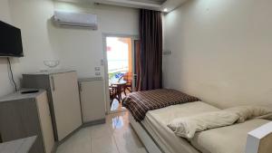 A bed or beds in a room at Casablanca beach resort, first line with private beach and swimming pools,