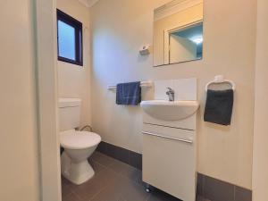 a bathroom with a toilet and a sink at Exchange Hotel Greenbushes in Greenbushes