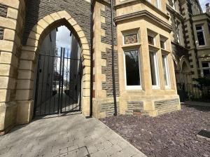 an entrance to a building with a black gate at Superior Stay, Sophia Gardens, City Centre and Stadium Sleeps 4 in Cardiff