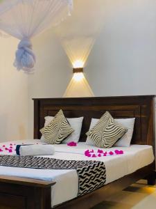 Letto o letti in una camera di Lucky Villa Sigiriya
