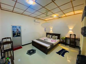 Letto o letti in una camera di Lucky Villa Sigiriya