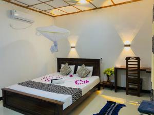 Letto o letti in una camera di Lucky Villa Sigiriya