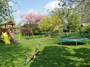 a park with a playground with a slide and swings at 2 bed property in Axminster BLOLO in Axminster