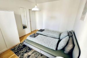 a bedroom with a bed in a room at Cosy & New Urban Apartment in Green Hood in Vienna