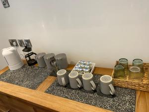 a counter top with a bunch of appliances on it at Luxe rooms in Edinburgh +50 photos