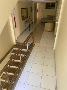 an empty hallway with a staircase in a building at Hotel Rio Center in Juazeiro
