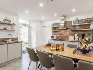 a kitchen with a large wooden table and chairs at 4 Bed in Wick 91390 in Wick
