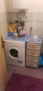 a laundry room with a washing machine in a room at MIMA in Jajce