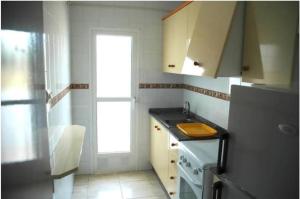 Kuchnia lub aneks kuchenny w obiekcie Apartamentos los Boliches