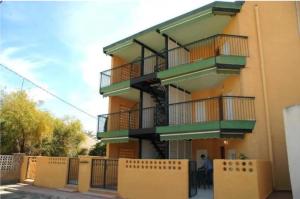 a building with balconies on the side of it at Apartamentos los Boliches in Puerto de Mazarrón