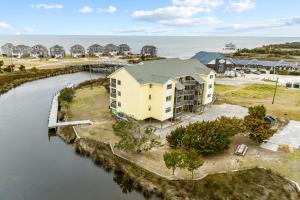 an aerial view of a building next to a body of water at Spencer's Watch in Avon