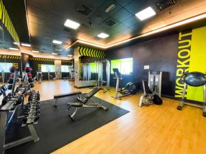 a gym with several treadmills and exercise equipment in it at Deluxe - Sea view - Dubai Marina in Dubai