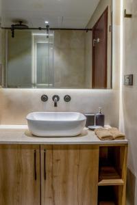 a bathroom with a white sink and a mirror at Deluxe - Sea view - Dubai Marina in Dubai