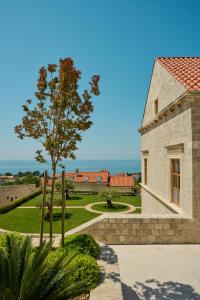 a building with a view of the ocean at Palace Natali in Dubrovnik