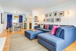 a living room with a blue couch and a table at Wicks Home - Desirable Neighborhood Near Downtown home in Kalamazoo