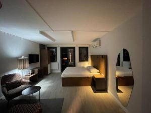 a hotel room with a bed and a mirror at Vicolo Otel in Istanbul