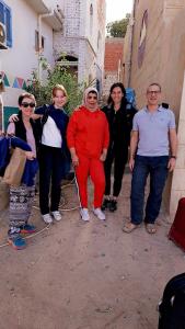 a group of people standing next to a building at Queen House in Aswan