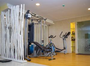 a gym with a treadmill and a exercise bike at Hotel Capilla del Mar in Cartagena de Indias