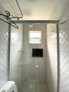a bathroom with a shower with a glass door at Pousada Village Rio Centro in Rio de Janeiro +93 photos