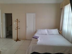 Кровать или кровати в номере Hotel Palermo Quintero