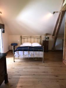 a bedroom with a bed in a attic at Les Gelots in Villemurlin