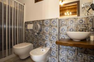 Ванная комната в Arcaloro Resort Rooms Volpe