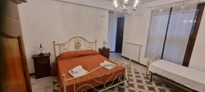 Кровать или кровати в номере Arcaloro Resort Rooms Volpe