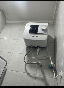 a toaster sitting on the floor in a room at 1bedroom serviced apartment in Benin City in Benin City