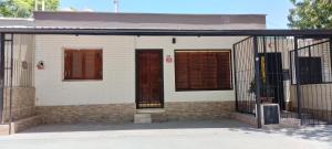 a house with two doors and a fence at Señor Aconcagua in Godoy Cruz