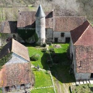 an aerial view of an old building with a tower at Chateau Mareuil in Brigueuil-le-Chantre