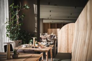 A restaurant or other place to eat at OLM Nature Escape - Eco Aparthotel