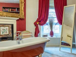 a bathroom with a tub and a fireplace at 9 Bed in Welshpool 40870 in Llanfyllin +35 photos