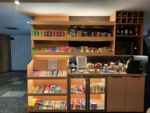 a store with a counter with food on it at Royalty Copacabana Hotel in Rio de Janeiro