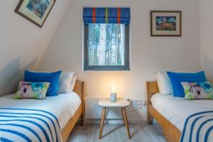 Postel nebo postele na pokoji v ubytování Reedcutter Lodge