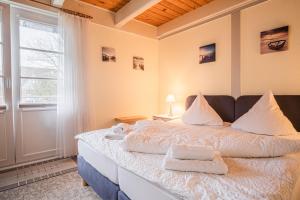 Postel nebo postele na pokoji v ubytování Haus Möwe