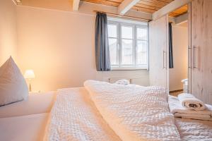 Postel nebo postele na pokoji v ubytování Haus Möwe