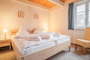Postel nebo postele na pokoji v ubytování Haus Möwe