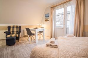 Postel nebo postele na pokoji v ubytování Haus Möwe
