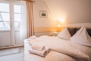 Postel nebo postele na pokoji v ubytování Haus Möwe
