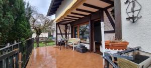 a porch of a house with a patio at Haus - Baden-Baden - 8x Zimmer in Sandweier