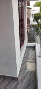 a view from the outside of a building with a wooden floor at Hornbill inn in Cochin
