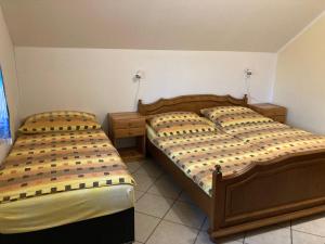 Кровать или кровати в номере Ubytování Pohoda