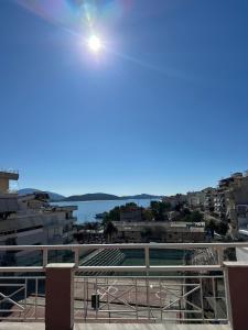 a view of a city from a balcony at Olivias Apartments City Center in Sarandë