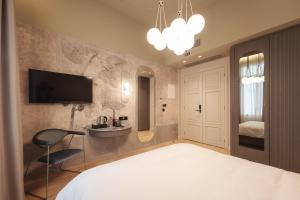 Ein Bett oder Betten in einem Zimmer der Unterkunft Zenith Premium Suites