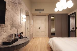 Ein Bett oder Betten in einem Zimmer der Unterkunft Zenith Premium Suites