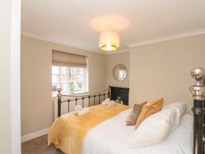 Postel nebo postele na pokoji v ubytování Kestrel Cottage