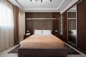 Postel nebo postele na pokoji v ubytování Appart-Hotel IMMOKA