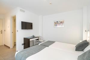 Cama o camas de una habitación en Alda Soria Rooms