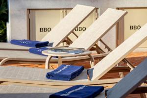 a group of chairs and a table with blue napkins at Luxury Villa Constanza near Poreč for 8 people only 2 km from the sea in Vabriga +36 photos