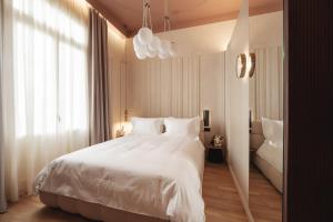 Ein Bett oder Betten in einem Zimmer der Unterkunft Zenith Premium Suites